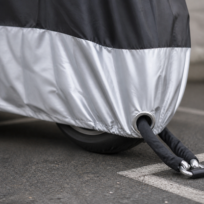 Motorcycle cover lock-hole detail with a rider's own chain lock
